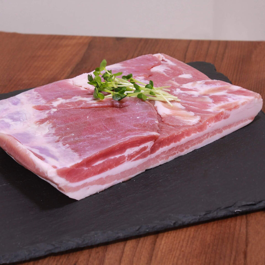 A big block of juicy pork belly from France. Best cut in thin slices and roasted in a frying pan or on a charcoal grill. You can even cure it and make your own bacon if you want to.